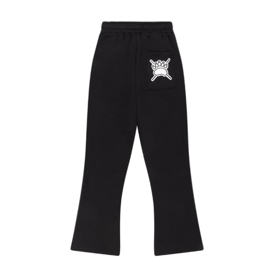 Black flared jogger with an elastic waistband and a white graphic print of a crown on a crossbones on the upper right hip, shown against a light gray background.